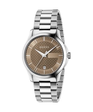 Ontdek de elegantie van de Gucci G-Timeless YA126445, een verfijnde unisex horloge dat stijl en functionaliteit combineert. Dit schitterende uurwerk heeft een 38mm roestvrijstalen kast en een opvallende bruine wijzerplaat, geaccentueerd met luminescente zilverkleurige wijzers. Het krasbestendige saffierglas zorgt voor duurzaamheid, terwijl de datumaanduiding op 6 uur praktische toepassingen biedt. Met een waterbestendigheid tot 50 meter is dit horloge perfect voor elke gelegenheid. De stijlvolle zilverkleurige bracelet maakt dit moderne accessoire compleet, waardoor het ideaal is voor degenen die verfijnd design waarderen.