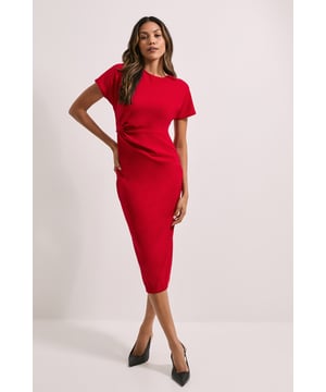 Elegant twist detail at the waist for a flattering silhouette
        Midi length offers versatile coverage for various occasions
        Short sleeves provide comfort and arm coverage
        Crew neckline adds a classic touch to the design
        Figure-hugging scuba fabric ensures a sleek fit
    
    This Dorothy Perkins Twist Scuba Midi Dress is a versatile addition to your wardrobe, perfect for the woman who appreciates both style and comfort. The twist detail at the waist creates a flattering shape, while the midi length offers just the right amount of coverage for various casual events. Style this dress with a pair of comfortable flats and a denim jacket for a relaxed brunch with friends. For family gatherings, dress it up with a statement necklace and wedge sandals. The scuba fabric hugs your curves in all the right places, making it an ideal choice for baby showers or afternoon tea. Its simplicity allows for easy accessorising - add a colourful scarf or a long pendant necklace to change up your look. Whether you're heading to a casual work event or meeting the girls for coffee, this dress will keep you looking polished and feeling confident throughout the day.