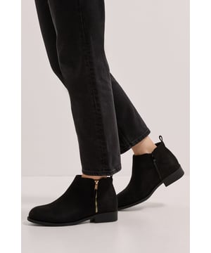 Sleek ankle boots featuring a convenient side zip for effortless wear
        Flat heel design (under 2cm) offering all-day comfort without sacrificing style
        Smooth, clean silhouette with minimal detailing for versatile styling options
        Subtle rounded toe shape creates a flattering line that works with various outfits
        Durable construction with a low-profile sole suitable for everyday wear
    
    The Maddy Side Zip Flat Boots from Dorothy Perkins deliver the perfect blend of practicality and understated elegance. These versatile ankle boots feature a convenient side zip that makes them a dream to slip on and off whilst maintaining a sleek appearance. Style them with rolled-up skinny jeans as shown for casual weekend brunches with friends, or pair with opaque tights and a midi dress for baby showers and family gatherings. The flat heel ensures comfort for all-day wear, whether you're dashing between shops or enjoying a leisurely coffee catch-up. Their minimalist design works beautifully with both casual and smart-casual ensembles, making them a wardrobe staple that transitions effortlessly between seasons. The clean lines and unfussy silhouette ensure these boots will remain a favourite for years to come, offering remarkable versatility for the fashion-conscious woman who values both style and comfort.
