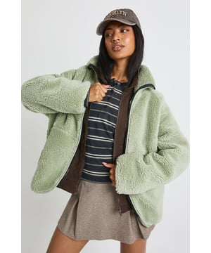 Plush teddy texture for ultimate comfort and warmth
        Oversized silhouette perfect for layering over any outfit
        Full-length zip fastening with high collar for extra protection against the elements
        Relaxed drop shoulders and roomy sleeves for effortless movement
        Versatile cropped length that pairs beautifully with both trousers and skirts
    
    Embrace casual cool with this irresistibly soft Oversized Teddy Jacket from Boohoo. The cosy texture and relaxed fit make it the perfect companion for those chilly days when comfort is key but style can't be compromised. As seen on our model, pair with a striped top and mini skirt for an effortlessly trendy look, or throw over your favourite jeans and trainers for weekend coffee runs. The versatile design works brilliantly with knee-high boots for an autumn-ready ensemble that's both practical and fashion-forward. This jacket is ideal for casual gatherings, university lectures, or laid-back brunches with friends. The oversized nature allows for easy layering over jumpers when temperatures really drop, whilst the cropped length ensures your silhouette isn't overwhelmed. A true wardrobe hero that will see you through the seasons in style.