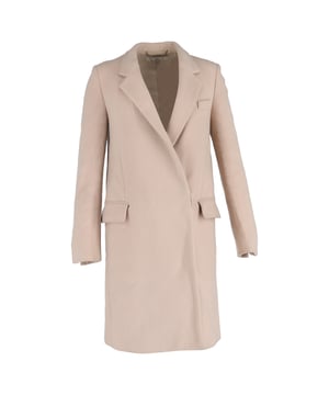 VINTAGE, RRP AS NEW
The Stella McCartney Hidden-Buttoned Coat in Pale Pink Wool exudes understated elegance with its clean lines, minimalist design, and soft pastel hue. Expertly tailored from luxurious wool, it offers warmth without bulk, making it a refined choice for cooler seasons. **Style tip:** Layer it over a monochrome outfit or neutral knits to let the subtle pink tone stand out, and finish with heeled boots for a polished, modern look.

 Stella Mccartney Hidden-Buttoned Coat in Pale Pink Wool

Condition: Excellent
Signs of wear: No visible signs of wear
Packaging: None
Color: Pink
Material: Wool
Size: EU | 40
Measurements: Length: 980; Chest: 450
SKU: NAPPUGBCL554953W