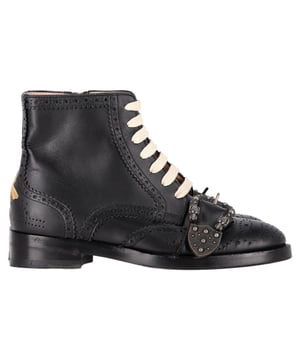VINTAGE, RRP AS NEW
Gucci’s Queercore Brogue Wingtip Boots are a masterclass in blending tradition with rebellion. Crafted in smooth black leather, these round-toe boots feature classic brogue detailing, a Dionysus buckle at the vamp, and gunmetal hardware for a moody finish. The stacked 1.25-inch heel adds subtle lift, while a gold-embroidered bee at the heel offers a signature Gucci touch. Sharp, subversive, and unapologetically bold.

Gucci Queercore Brogue Wingtip Boots in Black Leather
Condition: Very good
Signs of wear: Minor markings, Lightly used but very well maintained. Minor mark at soles & creasing, light scuffing at the soles and heels.
Packaging: None
Color: black
Material: Leather | leather
Size: EU | 35
Measurements: Heel height: 30; Insole length: 280
SKU: NAPPUGBSH545968W