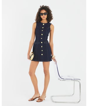 Denim fabric, Round neckline, Sleeveless, Decorative pockets, Gold button embellishment, Zip fastening, Mini length