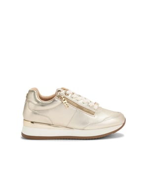 This KG Kurt Geiger Lina sneaker features a metallic gold upper with texture. There is a gold tone zip next to the eyestay and two branded charms on the laces and heel.