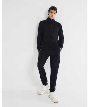 Slim fit, Textured stretch fabric, Open hem, Side slip pockets, Elasticated drawstring waist