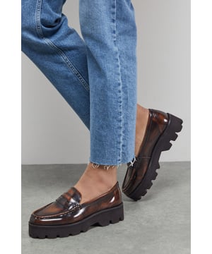 Genuine leather construction with distinctive rub-off finish for authentic character
        Classic penny loafer design reimagined with contemporary chunky creeper sole
        Comfortable flat heel measuring between 0-2cm for all-day wearability
        Durable treaded platform sole adding edgy contrast to the traditional silhouette
        Detailed stitching around the vamp enhances the craftsmanship of these Faith loafers
    
    The Beatie Chunky Creeper Loafers from Faith brilliantly merge timeless penny loafer styling with bold contemporary attitude. The striking contrast between the polished leather upper and substantial treaded sole creates a statement piece that works effortlessly with casual ensembles. Style these versatile flats with straight-leg jeans and an oversized jacket for weekend coffee dates, or pair with a midi skirt and crisp white shirt for a modern twist on workwear. The comfortable flat design makes them ideal for city explorations or casual family gatherings where style needn't compromise on comfort. Their chunky aesthetic adds an unexpected edge to feminine dresses, whilst the classic penny detail maintains a connection to traditional British footwear heritage. These loafers transition seamlessly from daytime casual to relaxed evening settings, making them a hardworking addition to your footwear collection.