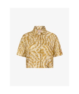 
De JOSH V Ziya blouse in de kleur Gold Green is een cropped blouse met korte mouwen. Het blousje is verrijkt met een zebrapatroon een goudkleurige lurex details. De blouse is verder gevoerd en schijnt hierdoor niet door. Als je op zoek bent naar een chique en bijzondere blouse voor de zomer, is de Ziya blouse perfect. Combineer de blouse met de JOSH V Paige shorts en sandalen voor een mooie, zomerse look.

