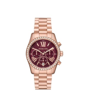 The Michael Kors MK7275 Lexington chronograph showcases a stainless steel bracelet and a bold, textured bezel. Its chronograph dial is powered by quartz movement, offering both precision and utility. Strong and stylish, it’s water resistant for everyday wear. A modern timepiece with classic appeal.