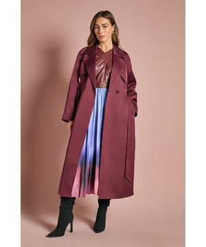 Luxurious satin finish trench coat with a sumptuous sheen that catches the light beautifully
        Classic double-breasted design with wide lapels for a timeless silhouette
        Detachable belt to cinch the waist and create a flattering, defined shape
        Regular fit with full-length sleeves offering versatile styling options year-round
        Back vent detail for ease of movement and a sophisticated drape
    
    Make a striking entrance at any special occasion with this Coast satin trench coat. The lustrous fabric creates a refined look that transitions effortlessly from day to evening events. Style as seen with a metallic top and pleated skirt for a contemporary ensemble that commands attention, or layer over a tailored dress for wedding guest perfection. The collared neckline and belted waist offer a structured elegance that works brilliantly for the races, formal dinners, or sophisticated cocktail parties. For evening affairs, pair with sleek heeled boots and statement earrings to enhance the coat's dramatic appeal. This versatile outerwear piece will become your go-to for adding polish to any outfit when you want to make an impression at smart occasions throughout the seasons.