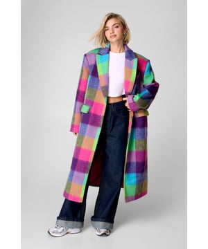 Bold multi-check pattern in vibrant hues
        Single-breasted design with notched lapels
        Long, relaxed fit for a statement silhouette
        Wool blend fabric for warmth and comfort
        Versatile tailored coat suitable for various occasions
    
    Make a striking impression with this eye-catching multi-check tailored coat from NastyGal. The relaxed fit and long silhouette create a bold statement piece that's perfect for adding a pop of colour to your autumn and winter wardrobe. Style this coat over a simple white crop top and wide-leg jeans for a casual yet chic look, or dress it up with a sleek black dress and heeled boots for evening events. The versatile design allows for endless styling possibilities, making it an ideal choice for family gatherings, brunch dates, or art gallery visits. The wool blend fabric ensures you stay cosy during cooler months without compromising on style. Embrace the vibrant check pattern and let this coat be the focal point of your ensemble, pairing it with neutral accessories to balance the look.