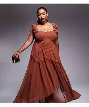 Dresses by ASOS Curve From one occasion to another Bandeau style Flutter sleeves Ruched bodice Regular fitSold By: Asos