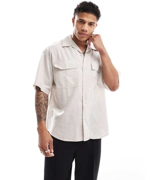 Shirts by Jack & Jones Do the smart thing Plain design Revere collar Button placket Chest pockets Short sleeves Oversized fitSold By: Asos