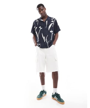 Shirts by Selected Homme We like your style Leaf print Revere collar Button placket Short sleeves Oversized fitSold By: Asos