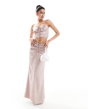 Skirts by ASOS DESIGN Part of a co-ord set Top sold separately Mid rise Ruched waist Tie detail Zip-back fastening Slim fitSold By: Asos
