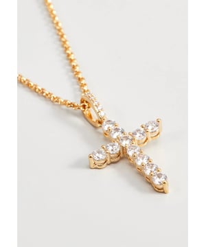 38+5 cm lange ketting van gerhodineerd metaal met kruisvormige hanger met witte kristallen. Gepersonaliseerd label met logo.