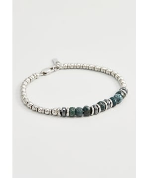 20 cm lange roestvrijstalen armband met mosgroene agaatstenen en stalen stoppers. Label gepersonaliseerd met logo.