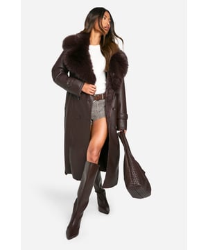 Luxurious faux fur collar for added warmth and style
        Double-breasted front with button closure for a classic trench look
        Belted waist to accentuate your figure
        Long length design for maximum coverage and drama
        Sleek PU fabric for a leather-like appearance
    
    Make a bold statement with this striking trenchcoat, perfect for those nights out when you want to turn heads. The dramatic faux fur collar adds a touch of glamour, while the classic double-breasted design keeps it timeless. Cinch in the waist with the belt for a flattering silhouette, or leave it open for a more relaxed vibe. Pair with knee-high boots and a mini skirt for a daring night-out look, or throw it over a sleek bodycon dress for a chic dinner date ensemble. The versatile design allows for endless styling options, making it a must-have piece for your wardrobe. Whether you're hitting the club or meeting friends for drinks, this coat will ensure you're the centre of attention wherever the night takes you.