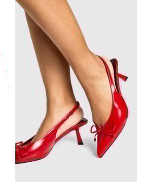 Elegant pointed toe design with charming bow detail for a feminine touch
        Comfortable low heel measuring between 2.5-4.5cm perfect for extended wear
        Slingback strap provides secure fit with added style
        Wide fit design offers extra room for all-day comfort
        Sleek silhouette with a glossy finish for a sophisticated look
    
    These Wide Fit Bow Detail Low Slingback Court Shoes from Boohoo combine practicality with chic styling. The pointed toe and dainty bow create a refined silhouette that works wonderfully for evening occasions without sacrificing comfort. The low heel provides just enough height to enhance your posture whilst remaining comfortable for dancing the night away. Style these versatile courts with a midi dress and statement earrings for drinks with the girls, or pair with tailored trousers and a silky blouse for more formal gatherings. The slingback design offers a secure fit whilst showcasing a touch of ankle - always a flattering look. These shoes are particularly brilliant for those nights out when you want to look polished but know you'll be on your feet for hours - the wide fit ensures there's no pinching or discomfort as the evening progresses.