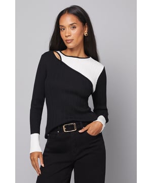 Stylish colour block design with contrasting ribbed detail for contemporary appeal
        Flattering crew neckline with distinctive asymmetric panel placement
        Soft knitted fabric offering comfort without compromising on style
        Long sleeves with contrasting cuffs for a polished finish
        Regular fit silhouette that complements various body shapes
    
    This sophisticated Wallis knitted top combines modern design with everyday wearability. The distinctive colour block pattern and ribbed texture create visual interest while maintaining a refined aesthetic. Style with wide-leg trousers and a statement belt as shown for an effortlessly chic daytime look. Perfect for family gatherings, brunches with friends, or casual office settings, this versatile piece transitions seamlessly from day to evening. Pair with your favourite jeans and trainers for a relaxed weekend ensemble, or dress up with tailored trousers and ballet flats for more polished occasions. The comfortable regular fit and soft fabric composition ensure you'll feel as good as you look, embodying the sophisticated glamour that defines the Wallis collection. A wardrobe essential that offers endless styling possibilities throughout the seasons.