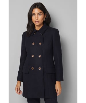 Classic double-breasted design with elegant metallic button detailing
        Tailored collar with notched lapels for a sophisticated silhouette
        Practical side pockets perfect for keeping essentials close at hand
        Regular fit cut designed to flatter the petite frame
        Long sleeves with button detail at cuffs for refined finishing
    
    This timeless pea coat from Wallis offers versatility and sophistication for your everyday wardrobe. The double-breasted front with its distinctive metallic buttons creates a structured look that pairs beautifully with both casual and smart-casual ensembles. Style with wide-leg trousers and ankle boots for a contemporary daytime look, or layer over a fine knit jumper with straight-leg jeans and trainers for weekend outings. The collared neckline provides extra warmth during cooler months whilst maintaining a polished appearance. Perfect for family gatherings, casual brunches or shopping trips, this coat effortlessly transitions between settings. The woven fabric provides structure while the regular fit ensures comfort throughout the day - a true wardrobe staple that will serve you season after season.