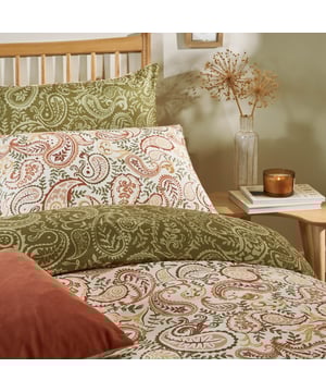 Bring a touch of timeless design to any bedroom with the Anika Paisley Printed Duvet Cover Set. Combining modern design with a soft-touch fabric, this bedding invites a sense of comfort and tranquillity. Inspired by traditional patterns and block printing, the intricate paisley design is intertwined with delicate foliage and presented in warm, earthy tones, creating a striking yet serene aesthetic. Easy to care for and crafted to feel as good as it looks, this duvet set offers effortless style, making it perfect for those seeking a cost-effective way to transform a bedroom into a cosy and inviting sanctuary.