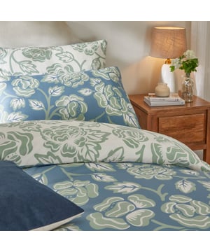 Transform your bedroom into a sanctuary with the Camellia Floral Printed Duvet Cover Set, where elegance meets comfort. The soft-touch fabric ensures a restful night's sleep, while the timeless floral design brings a connection to nature into your everyday space. Featuring delicate blooms in tranquil tones, this bedding set evokes the beauty of spring and summer all year round, infusing your home with a sense of calm and serenity. Reversible with a contrasting shade for added versatility, it’s perfect for those seeking effortless care and enduring style. Enjoy a design that feels as delightful as it looks.