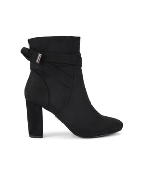 This Carvela Wide Fit edition Tempt ankle boot features a black leather alternative upper. There is a bow detail at the back of the ankle with gold tone branding. The inner side of the ankle features a zip for comfort. Heel height: 8.5cm.