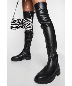 Over-the-knee design for a bold, statement look
        Chunky, flat sole with a height between 0 and 2cm for comfort and stability
        Sleek synthetic leather upper for a smooth, polished appearance
        Versatile style suitable for various casual occasions
        Robust tread pattern on the sole for improved grip
    
    Make a striking impression with these eye-catching over-the-knee boots from Boohoo. Perfect for the fashion-forward trendsetter, these boots combine style and practicality effortlessly. The flat, chunky sole ensures all-day comfort without compromising on aesthetics, making them ideal for various casual outings. Style them with a mini skirt and oversized jumper for a chic autumn look, or pair with skinny jeans and a leather jacket for an edgy ensemble. These versatile boots are a must-have for your wardrobe, suitable for everything from casual shopping trips to laid-back evenings out with friends. The durable construction and grippy sole make them a reliable choice for navigating city streets in style, while the sleek silhouette adds a touch of sophistication to any outfit.