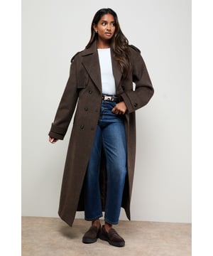Classic double-breasted design with traditional notched lapels
        Relaxed silhouette with generous proportions for effortless layering
        Practical self-tie belt to define the waist
        Full-length cut offering maximum coverage and warmth
        Shoulder epaulettes adding a touch of military-inspired detailing
    
    The Oasis Relaxed Wool Trench combines timeless design with contemporary styling for the perfect autumn-to-winter outerwear piece. This sophisticated coat features a relaxed fit that drapes beautifully over any ensemble, making it an incredibly versatile addition to your wardrobe. Style with straight-leg jeans and a simple white tee for casual weekend brunches, or layer over a knitted jumper and tailored trousers for chilly commutes. The self-tie belt allows you to create different silhouettes - cinch it tightly for a more defined shape or wear it loosely fastened for a nonchalant feel. The substantial length provides excellent protection against the elements whilst maintaining a feminine aesthetic that's characteristic of the Oasis brand. Perfect for family gatherings, shopping trips or casual meet-ups with friends, this coat will quickly become your go-to outerwear choice for the cooler months.