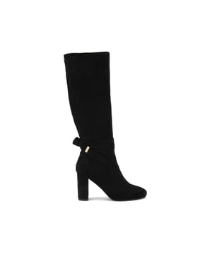 This Carvela Wide Leg edition of the Tempt High Leg boot features a black microsuede with an upper that reaches the knee. There is a knotted ankle strap with gold tone tip. Heel height: 8.5cm. This product features All Day Long technology.