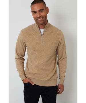 Freshen up your knitwear with this funnel neck quarter zip jumper from Threadbare. Crafted in a mini cable knit, this knitted jumper has a ribbed funnel neck with a concealed quarter zip, making it an easy throw-on piece. With ribbed cuffs and hem, this cosy jumper will keep you snug. Finished with the signature Threadbare metal branding tab on the hem. Simply team with a classic pair of jeans for a casual outfit that never goes out of style.