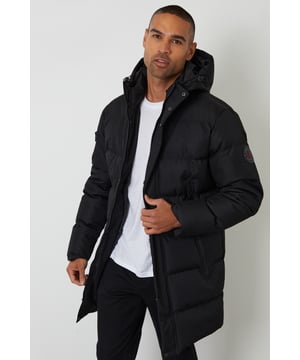 Embrace the elements with this Threadbare showerproof puffer jacket, your new go-to seasonal staple. Heavily padded for warmth and comfort, it features a microfleece-lined hood with a funnel neck collar and adjustable bungee cords for added protection. The full zip fastening is reinforced with snap fasteners and a storm guard to help keep out the chill. With fleece-lined zip pockets, a zipped arm pocket and an inner pocket, there’s plenty of space for your essentials. A regular fit in a longline cut, ideal for cold-weather layering.