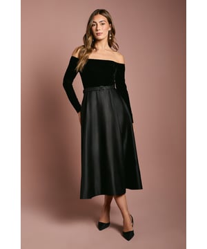 Luxurious velvet bardot bodice with elegant long sleeves         Striking full skirted midi silhouette with flattering A-line shape         Sophisticated belted waist detail creating a defined silhouette         Fully lined construction ensuring smooth drape and comfort         Versatile midi length perfect for formal occasions and evening events
    
    Make a captivating entrance at your next special occasion in this stunning Coast bardot midi dress. The sumptuous velvet bodice creates a beautiful contrast against the full, flowing skirt, whilst the off-shoulder neckline adds a touch of allure. The belted waist cinches in to create a feminine silhouette that flatters every figure. Style with pointed court heels and statement drop earrings as seen on the model for a refined evening ensemble. This versatile piece transitions beautifully from weddings to race days and formal dinners. For cooler evenings, layer with a tailored cape or wrap. The midi length offers both sophistication and practicality, allowing you to dance the night away with confidence whilst maintaining an air of elegance that Coast is renowned for.