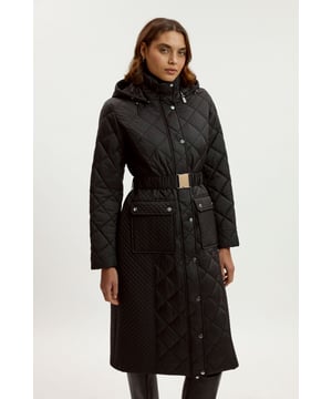 This Karen Millen quilted longline coat combines practicality with sophisticated style. The diamond quilting creates visual interest while providing essential warmth for cooler days. The adjustable belt cinches the waist, creating a feminine silhouette despite the coat's substantial coverage. The thoughtful design details, including the protective funnel neck and practical pockets, demonstrate the expert craftsmanship that Karen Millen is known for, ensuring this coat remains a wardrobe staple for seasons to come.  Longline quilted coat with diamond pattern Practical funnel neck design Flattering belted waist Functional front pockets Full-length design