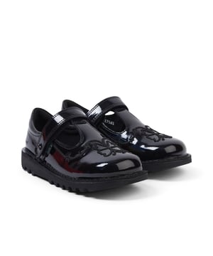 Girl's Kickers Kids Kick T Stardust Patent Shoe. Kickers Kick T Stardust Black Shoes feature a classic T-bar upper design with enchanting stars and butterfly embroidery on holographic black patent leather. The convenient hook and loop strap ensures easy wear, while the rubber sole, made from partly recycled rubber, adds durability and eco-friendliness. Material: Patent Leather Upper, Rubber Sole. Ref: 117581.