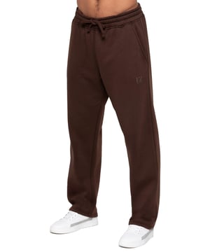 Crafted for comfort and style, the Enzo Milano Relaxed Fit Open Hem Jogger is made from premium brushed fleece cotton, offering a soft, durable, and cozy feel. Designed with a heavy rib elasticated waistband and adjustable drawcords, it ensures a secure yet flexible fit. Featuring two side pockets and a back welt pocket, it combines practicality with sleek design. The straight-leg silhouette with a clean stitched hem finish delivers a modern, laid-back look. Finished with the signature ENZO MILANO rubber print on the left leg.