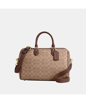 Our Rowan Large Satchel Bag has a timeless, structured silhouette that can carry it all. Crafted of Signature coated canvas, this large satchel bag has a spacious interior to fit your daily essentials and more. It features an outside zip pocket for easy access to go-to items, plus snap and zip po