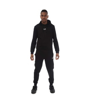Men's Emporio Armani EA7 Core Identity Cotton Tracksuit.- Hoodie:- Front pockets.- Elasticated cuffs and hem.- Contrasting EA7 logo.- Regular fit.- Fabric: 100% Cotton.- Joggers:- Elasticated waistband with inner drawstring fastening.- Side pockets.- Elasticated cuffs.- Contrasting EA7 logo.- Regular fit.- Fabric: 100% Cotton. Ref: 8NPV64VRZ1200.
