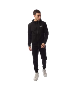 Men's Emporio Armani EA7 Core Identity Full-Zip Tracksuit.- Jacket:- Drawstring hood.- Full zip fastening.- Two side welt pockets.- Elasticated cuffs and hem.- Contrasting EA7 logo on the chest.- Regular fit.- Fabric: 100% Cotton.- Jogger:- Drawstring waist.- Two pockets.- Elasticated cuffs.- Contrasting EA7 logo.- Regular fit.- Fabric: 100% Cotton. Ref: 8NPV63VRZ1200.
