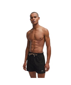 Mens BOSS Tio Logo-print swim shorts with full lining in blackSporty swim shorts crafted in soft material with full lining  a logo print and a signature-stripe trim inside the waistband by BOSS. - Elasticated waist with drawcord- Side pockets- Rear flap pocket- BOSS logo above left hem- Main material: 91% Polyester  9% Elastane.  Lining: 100% Polyester.  Machine washable.- Ref: 50491601-001