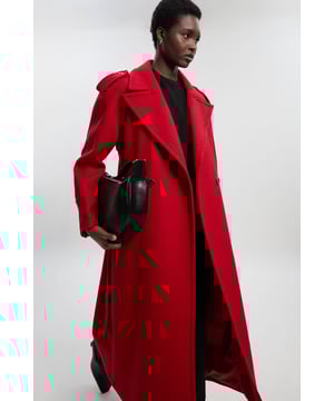 This sophisticated Karen Millen coat combines classic tailoring with contemporary styling for a versatile outerwear option. The belted waist creates a flattering shape that can be cinched or worn more relaxed. The substantial wool blend fabric provides warmth without bulk, making it ideal for autumn through winter wear. Perfect for casual work days or weekend plans, this coat will quickly become your go-to for elevating everyday ensembles. The timeless design ensures it will remain a wardrobe staple for years to come, easily dressed up with boots or down with trainers for truly versatile styling.  Tailored midi coat with elegant belted waist Structured shoulder detailing with decorative epaulettes Classic double-breasted design with statement buttons Wide notched lapels Practical side pockets