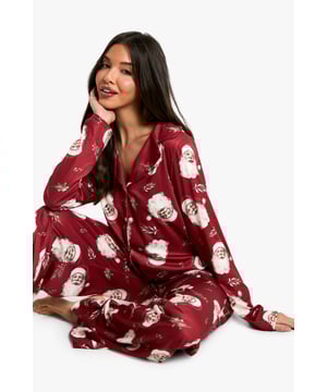 Charming vintage Santa print throughout
        Long-sleeved top with notched collar
        Button-down front for easy wear
        Matching full-length trousers
        Relaxed fit for ultimate comfort
    
    Embrace the festive spirit with this delightful long-sleeved pyjama set from Boohoo. The vintage Santa print adds a touch of whimsy to your nighttime routine, perfect for those cosy winter evenings. The button-down top features a classic notched collar, offering a smart yet comfortable look for lounging. Paired with full-length trousers, this set ensures you'll stay snug from head to toe. Whether you're settling in for a Christmas film marathon or enjoying a lazy Boxing Day morning, this pyjama set is your go-to for stylish comfort. It's also an ideal choice for those impromptu family photos on Christmas morning or for greeting unexpected holiday guests. The relaxed fit allows for easy movement, making it suitable for both sleeping and casual wear around the house during the festive season.