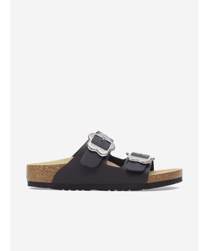 Introducing the elegant Girls Arizona Flower Buckle Sandals in Black by Birkenstock, a quintessential addition for any discerning young lady’s SS2025 wardrobe. Meticulously crafted, these sandals blend sophisticated style with peerless comfort. Key features include:

Chic Black Finish: Immaculate in jet black, offering versatility and timeless appeal.

Delicate Flower Buckles: Eye-catching floral accents provide a unique, feminine touch.

Renowned Birkenstock Footbed: Signature comfort ensures ease for all-day wear.

Durable Construction: Built to withstand the rigours of childhood adventures.

Elevate her style; secure these statement sandals today!