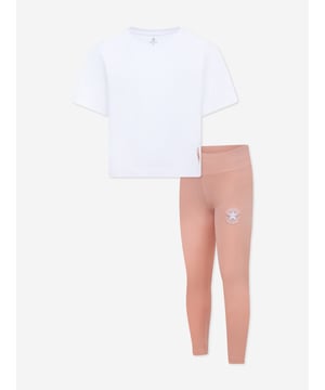 Discover the enchanting Converse Girls Boxy T-Shirt and Leggings Set in Pink, an exquisite addition to your little girl's SS2025 wardrobe. Perfectly blending style and comfort, this set ensures she stays at the forefront of fashion. Delightful details include Chic Boxy Cut Modern and stylish, the boxy silhouette of the t-shirt is effortlessly trendy. Vibrant Pink Hue A captivating pink colour enhances the youthful charm of the set. Premium Fabric Crafted with soft, luxurious fabrics for ultimate comfort and durability. Versatile Ensemble Ideal for both relaxed days in or playful outings.Step into style with this designer set by Converse. Order today and let her shine with confidence and flair!