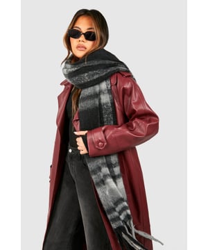 Oversized checked scarf for maximum cosiness
        Soft, brushed texture for ultimate comfort
        Stylish fringe detailing adds a trendy touch
        Versatile design suitable for various outfits
        Generous length allows for multiple styling options
    
    Wrap yourself in style and warmth with this chic checked scarf from Boohoo. Perfect for those chilly autumn days or frosty winter mornings, this versatile accessory is a must-have for your wardrobe. The generous size allows for creative styling - drape it loosely over your shoulders for a relaxed look, or wrap it snugly around your neck for extra warmth. Pair it with a sleek leather jacket and skinny jeans for an edgy street style, or throw it over a cosy jumper dress for a more laid-back vibe. The classic check pattern and fringe detailing make this scarf an ideal companion for casual outings, family gatherings, or even a day at the office. It's the perfect finishing touch to elevate your everyday ensembles whilst keeping you snug and stylish.