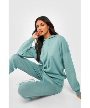 Cosy knitted hoodie and trouser set for ultimate comfort
        Relaxed fit design for effortless style and movement
        Ribbed cuffs and hem for a snug, secure fit
        Convenient side pockets on trousers for practicality
        Versatile two-piece ensemble for mix-and-match styling
    
    Embrace laid-back chic with this knitted tracksuit from Boohoo. Perfect for those lazy weekends or casual outings, this ensemble offers both style and comfort in equal measure. The hoodie features a classic design with a roomy hood, while the trousers provide a relaxed fit for all-day ease. Style it with trendy trainers for a cool, off-duty look, or dress it up with statement jewellery for a more polished appearance. Ideal for family gatherings, coffee dates with friends, or simply lounging at home, this tracksuit is a versatile addition to your wardrobe. The soft, knitted fabric ensures you stay cosy without compromising on style, making it a go-to choice for the fashion-forward woman who values both comfort and trend-setting looks.