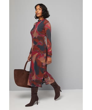 Elegant high neck midi dress featuring a striking abstract mesh design
        Sophisticated long sleeves for versatile seasonal styling
        Flattering midi length with a subtle side split for ease of movement
        Delicate keyhole detail at the back adds a refined touch
        Soft jersey fabric offers comfortable stretch for all-day wear
    
    Make a statement in this captivating abstract mesh high neck midi dress from Wallis. The sophisticated high neckline and long sleeves create a refined silhouette that transitions effortlessly from day to evening. Style with knee-high boots and a structured tote for family gatherings or weekend brunches. The fluid jersey fabric drapes beautifully while offering comfortable stretch that moves with you throughout the day. For a more casual approach, pair with leather trainers and a denim jacket, or dress it up with block-heeled ankle boots and statement earrings for dinner dates. The versatile midi length works wonderfully for various daytime occasions, from shopping trips to casual meet-ups with friends. This dress combines contemporary design with everyday comfort, making it a standout addition to your casual wardrobe.