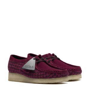 Moccasin style shoe with Harris Tweed quarter panels and soft suede on the vamp, collar, and trim. Features a classic moccasin construction and a natural pebble crepe sole for comfort and grip.