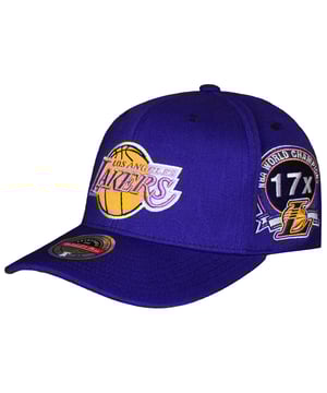 Show your Los Angeles Lakers pride with the Mitchell &amp; Ness NBA Los Angeles Lakers Home Town Classic Cap. Featuring a classic design with bold Lakers branding, this cap offers a timeless way to represent your team. Perfect for game days, casual wear, or any occasion where you want to showcase your Lakers spirit, this cap combines comfort, style, and a nod to the team’s rich legacy.
Key Features:
Official NBA Merchandise: 

Authentic Mitchell &amp; Ness cap celebrating the Los Angeles Lakers.

Bold Lakers Branding: 

Features the iconic Los Angeles Lakers logo prominently on the front for a standout look.

Premium Fabric Construction: 

Made from high-quality materials for durability and all-day comfort.

Curved Brim: 

Designed for a sleek, classic look that complements any outfit.

Structured Six-Panel Design: 

Ensures the cap retains its shape and provides a comfortable, well-formed fit.

Adjustable Snapback Closure: 

Customizable and secure fit for all head sizes.

Mitchell &amp; Ness Branding: 

Signature logo embroidered on the back for an authentic finish.

The Mitchell &amp; Ness NBA Los Angeles Lakers Home Town Classic Cap is the perfect accessory to show off your Lakers pride. Wear it proudly and support your team in style!