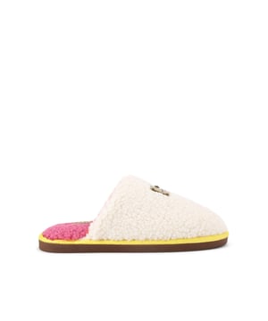 This Kurt Geiger Slipper features a beige soft Borg upper with yellow trim around the sole. The inside is lined in orange with a pink footbed. There is a branded tab on the toe with a small antiqued brass eagle head.